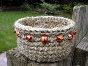 jute basket with maroon wooden beads